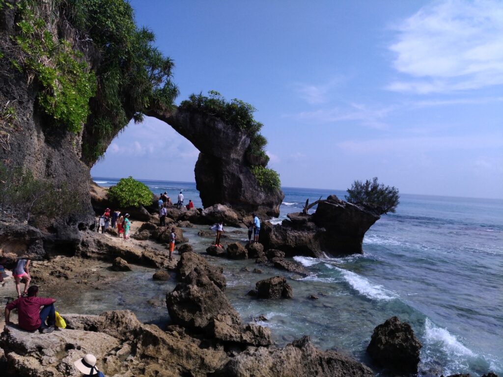 Tourists exploring the famous Natural Bridge at Neil Island Andaman, also known as Coral Bridge