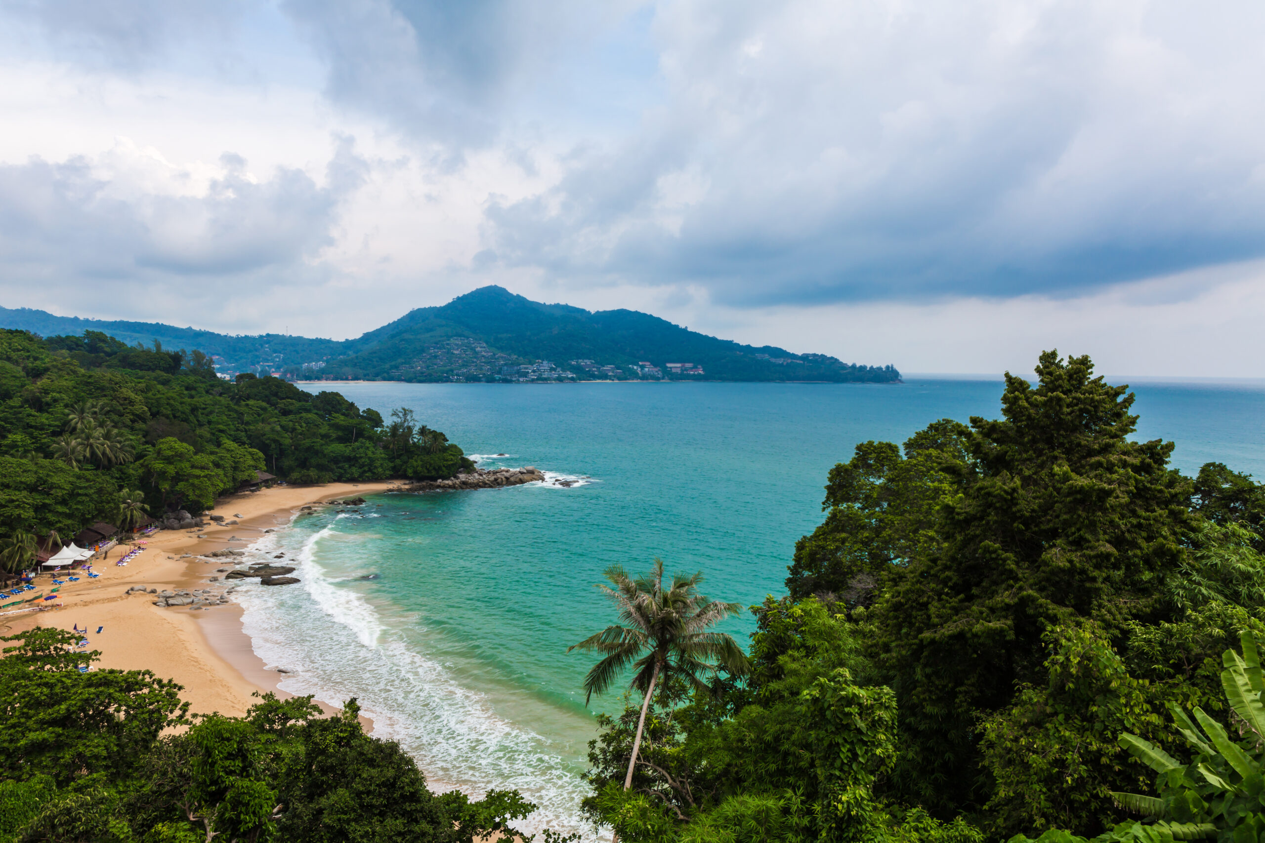 Scenic view of Neil Island beach with turquoise waters, golden sand, and lush green trees – a must-visit destination in Andaman.