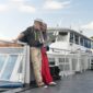Tourists on a ferry from Port Blair to Neil Island checking a map while traveling.