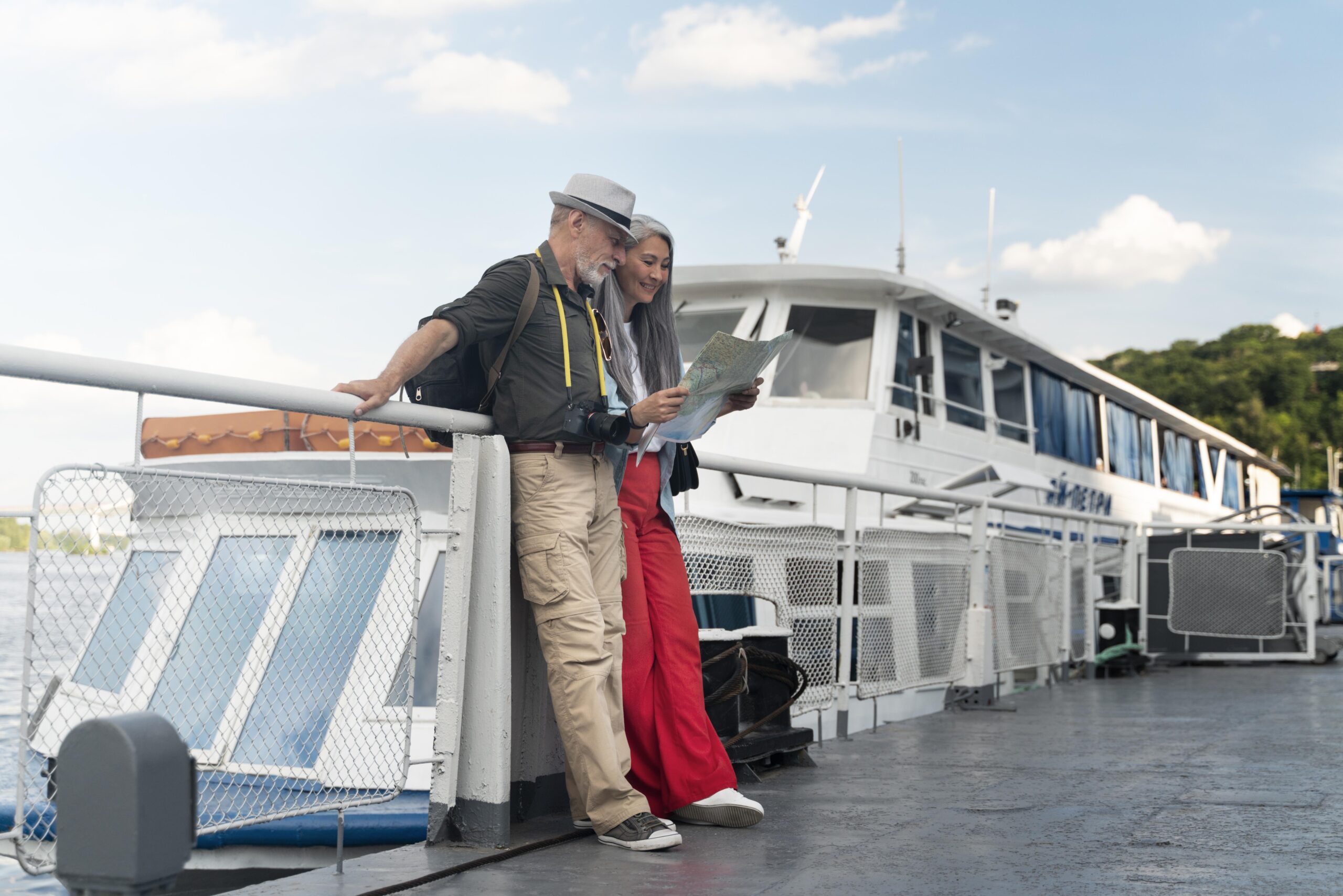 Tourists on a ferry from Port Blair to Neil Island checking a map while traveling.